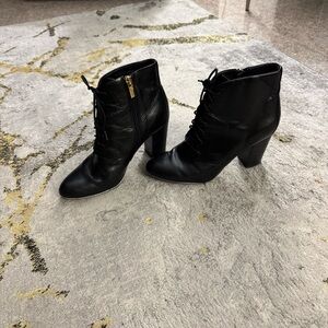 Isola Black Heeled Boots with Gold Zipper